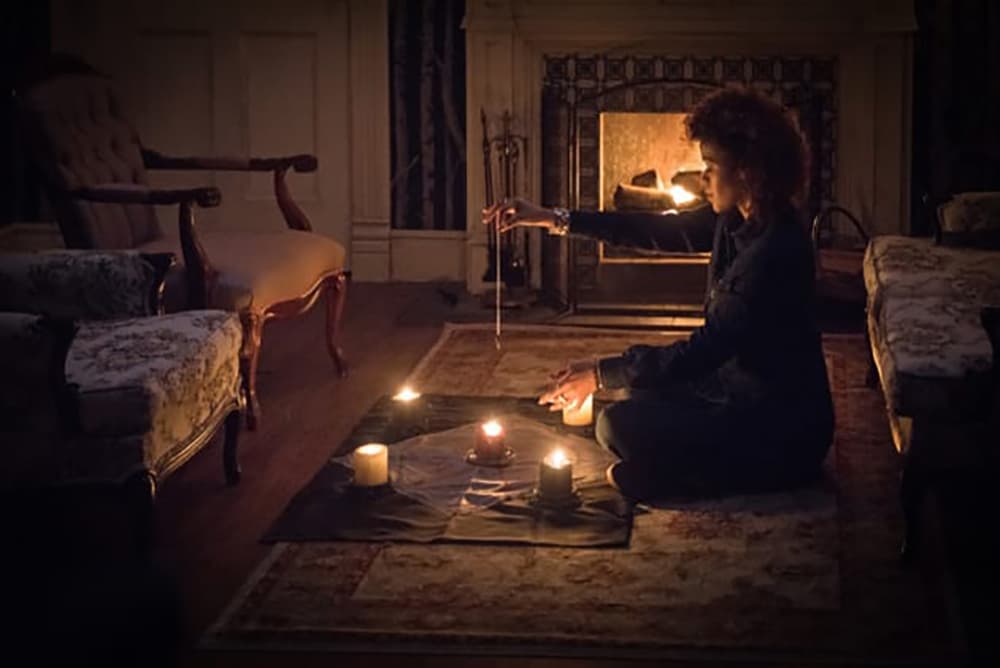 Tasha lighting candles